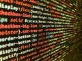 Simple website HTML code with colourful tags in browser view on dark background. Programmer working in computer screen. Abstract Royalty Free Stock Photo