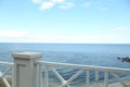 Simple white balustrade near beautiful tranquil sea