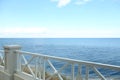 Simple white balustrade near beautiful tranquil sea