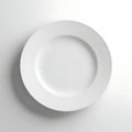 Simple white ceramic dinner plate cast a soft shadow on a clean bright surface Royalty Free Stock Photo