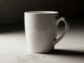 Simple white ceramic mug on a light surface Royalty Free Stock Photo