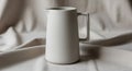 Simple white ceramic pitcher with a Royalty Free Stock Photo