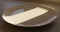 A simple white ceramic plate is Royalty Free Stock Photo