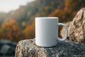 Blank White Mug on Rock with Autumn Scenery Royalty Free Stock Photo