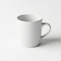 A simple white coffee mug on a plain white background with a subtle shadow Royalty Free Stock Photo