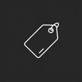 A simple white line drawing of a hanging price tag on a dark gray background. The ta Royalty Free Stock Photo