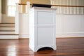 a simple white-painted wooden pulpit