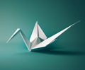 a simple white paper crane on a green studio background Royalty Free Stock Photo
