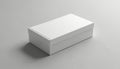 Simple white rectangular box rests on a plain grey surface. Clean, empty container with lid. Perfect for product mockups, design Royalty Free Stock Photo