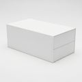 Simple White Rectangular Box with Two Drawer-like Compartments on a Light Grey Background Royalty Free Stock Photo