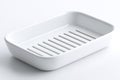 Simple white soap dish for bathroom or kitchen use featuring drainage slits Royalty Free Stock Photo