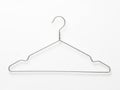 Simple wire clothes hanger against a plain background Royalty Free Stock Photo