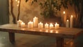 A simple wooden bench in the center of the room surrounded by candles beckons for a peaceful moment of mindful breathing
