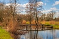 Simple wooden bridge over a Dutch creek Royalty Free Stock Photo