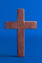 Simple Wooden Cross on a Blue Background Royalty Free Stock Photo