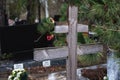 Simple wooden cross on a grave in a cemetery Royalty Free Stock Photo