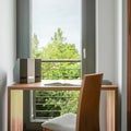 Simple wooden desk by window Royalty Free Stock Photo