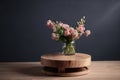 simple wooden round podium with a vase and fresh blooms on springtime