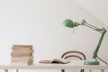 Simple workspace interior. Open book and a pile of books