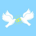 White silhouettes of  flying doves with wedding rings on blue background. Love concept. Royalty Free Stock Photo