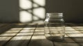 Simplicity in Shadows - Glass Jar on Wooden Table