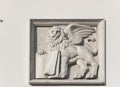 Saint Mark`s winged lion with a book on old house wall in Lviv, Ukraine Royalty Free Stock Photo