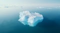 Simplistic image of solitary iceberg adrift in blue ocean