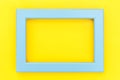 Simply design with empty blue frame isolated on yellow colourful trendy background
