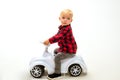 Simply just twist and go. Boy child on riding toy. Little child ride on toy car. Little baby enjoy playing in