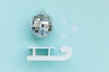 Simply minimal composition winter objects ornament ball sled isolated on blue pastel trendy background