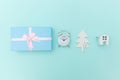 Simply minimal composition winter objects ornament fir tree ball gift box isolated on blue pastel trendy background