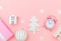 Simply minimal composition winter objects ornament sled fir tree ball gift box isolated on pink pastel trendy background