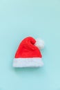 Simply minimal design Christmas Santa Claus hat isolated on blue pastel colorful trendy background