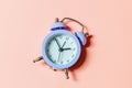 Simply minimal design ringing twin bell vintage classic alarm clock Isolated on pink pastel background. Rest hours time of life