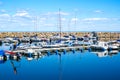 Simrishamn, Sweden - May 13, 2019: Boats at the marina on sunny day with reflectiom on water Royalty Free Stock Photo