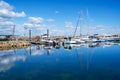 Simrishamn, Sweden - May 13, 2019: Boats at the marina on sunny day with reflectiom on water Royalty Free Stock Photo