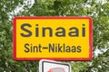 Sinaai, East Flemish Region, Belgium - Yellow road sign of the village and municipality of Sinaai, Sint-Niklaas