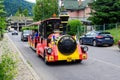 Sinaia, Romania - 3 July 2021: Colorful train for children in a street in the center of the city close to Bucegi Mountains (