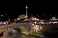 Sinan Pasha Mosque and stone bridge, landmarks in the city of Prizren, Kosovo, at night.