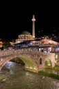 Sinan Pasha Mosque and stone bridge, landmarks in the city of Prizren, Kosovo, at night.