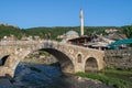 Sinan Pasha Mosque and stone bridge, landmarks in the city of Prizren, Kosovo, on a sunny day
