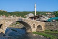 Sinan Pasha Mosque and stone bridge, landmarks in the city of Prizren, Kosovo, on a sunny day.