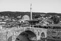 Sinan Pasha Mosque and stone bridge, landmarks in the city of Prizren, Kosovo, on a sunny day.