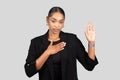 Sincere African American businesswoman making a pledge or swearing an oath