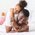 Adorable little african girl hugging her daddy Royalty Free Stock Photo
