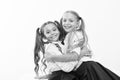 Sincere kids. Kids schoolgirls happy together. True friendship. Girls smiling happy faces hug each other white
