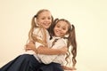 Sincere kids. Kids schoolgirls happy together. True friendship. Girls smiling happy faces hug each other white