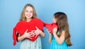 Sincere kids share tenderness and love. Girls hug red plush heart toy symbol love. Sisterhood concept. Valentines day Royalty Free Stock Photo