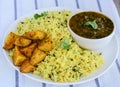 Sindhi thali- garlic rice,fried potatoes and lentils Royalty Free Stock Photo