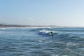 Surfer enjoying a surf session at Sao Torpes Beach in Sines on the Alentejo Coast Royalty Free Stock Photo